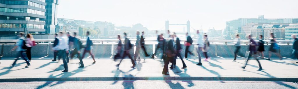 Business people crossing a bridge