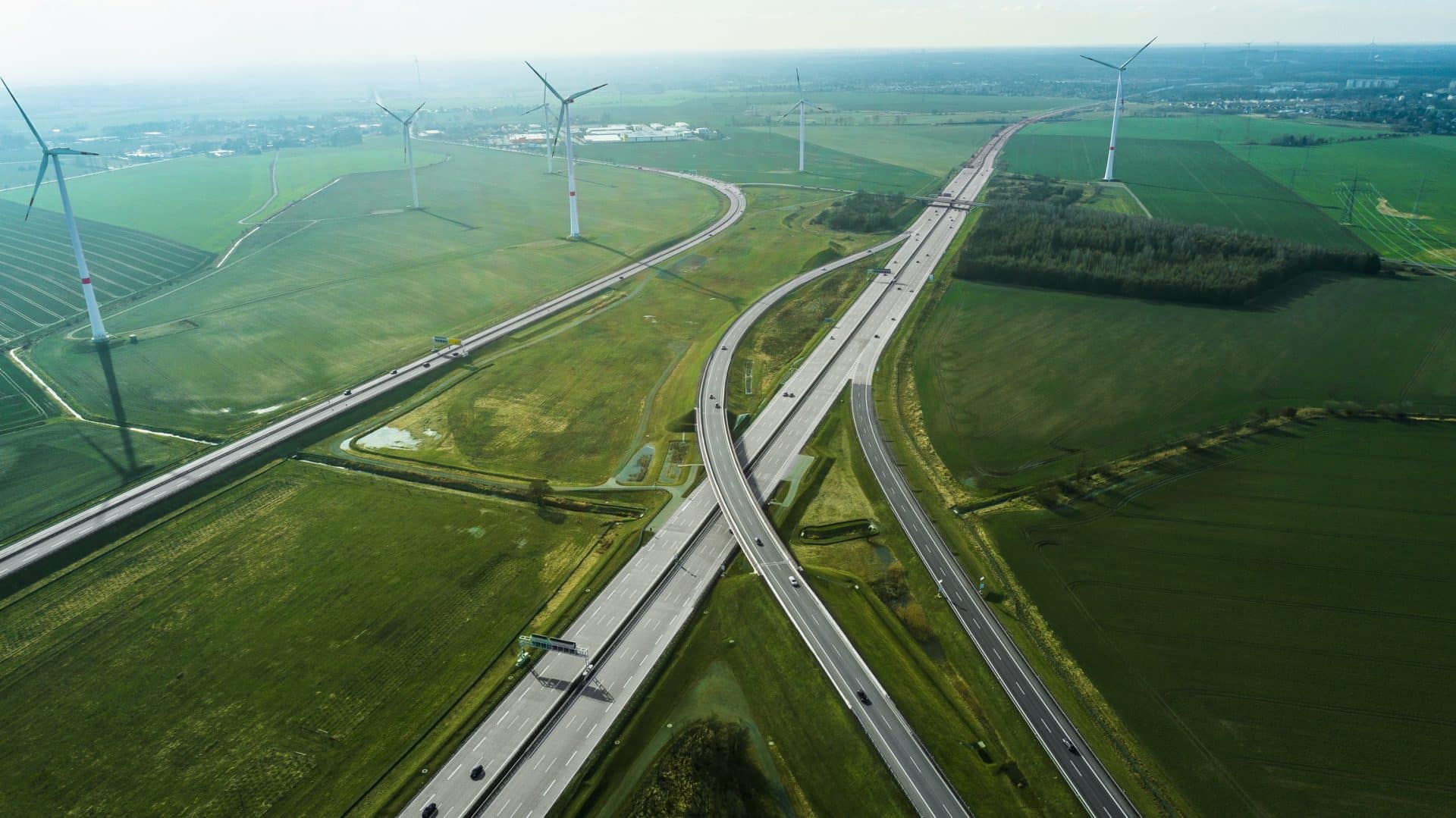 Aerial view of highways by wind turbines on field, Berlin, Brandenburg, Germany