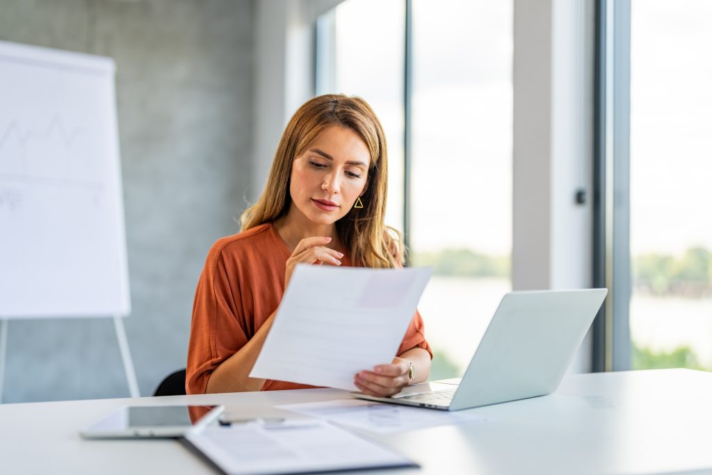 Business woman busy working on laptop computer at office