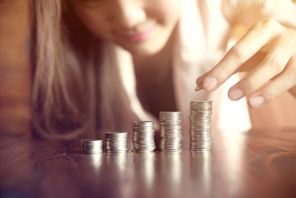 Asia business woman saving money for invest