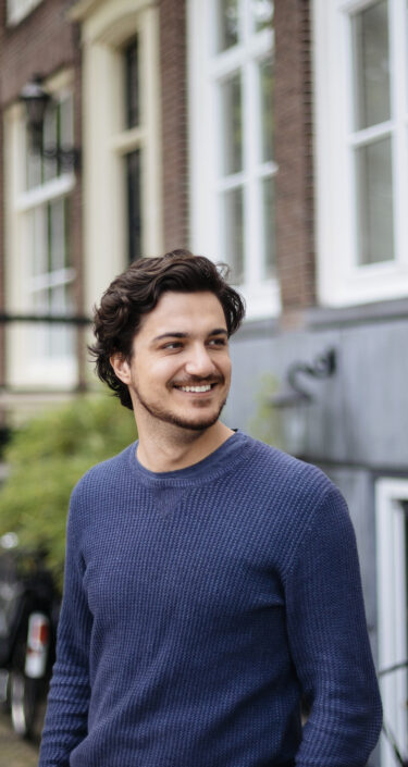 Portrait of a young handsome man on the streets of Amsterdam