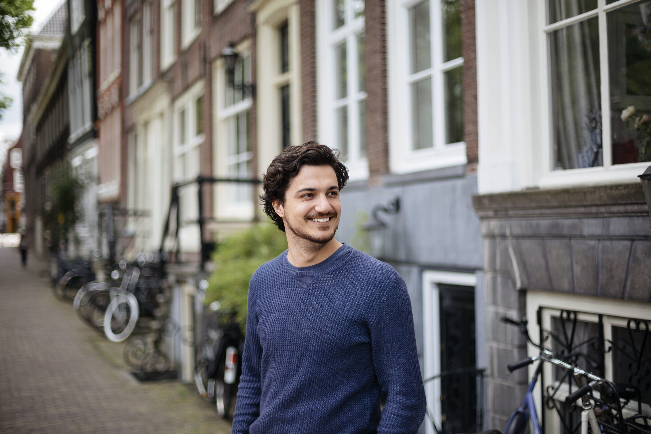 Portrait of a young handsome man on the streets of Amsterdam