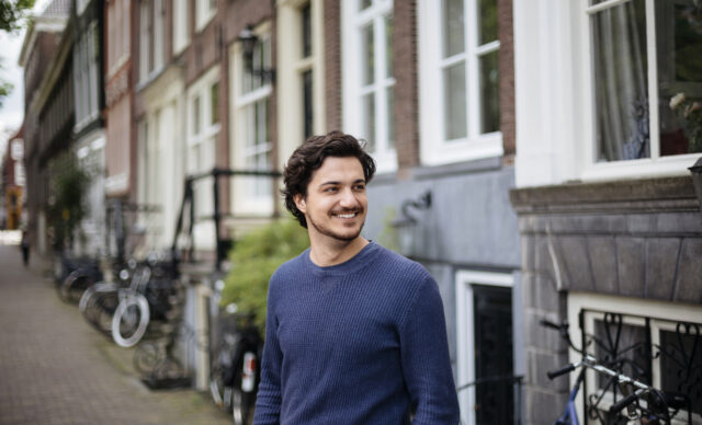 Portrait of a young handsome man on the streets of Amsterdam