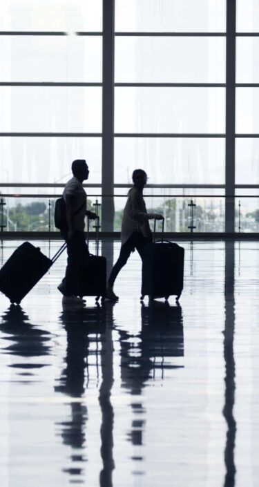 View of airport departures area travellers rushing