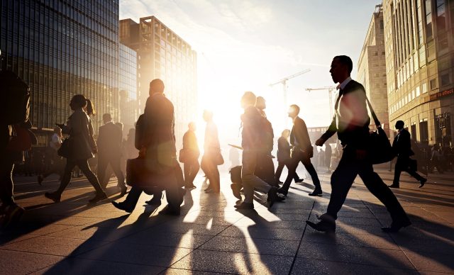 Business people walking to work in the city at sunrise.jpg