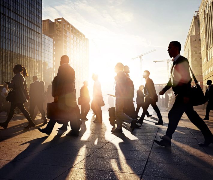 Business people walking to work in the city at sunrise.jpg