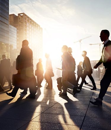 Business people walking to work in the city at sunrise.jpg