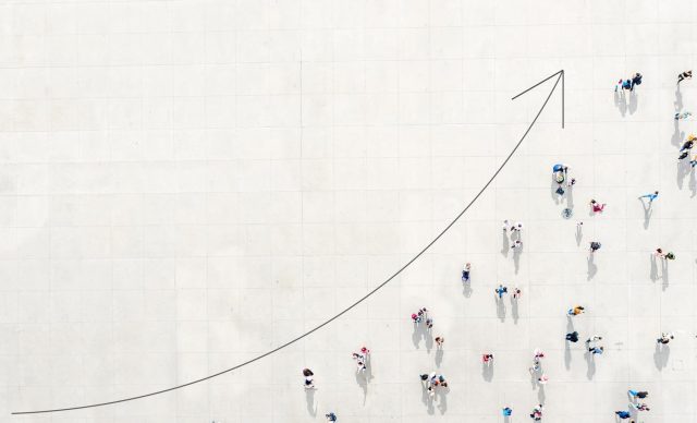 Crowd from above forming a growth graph