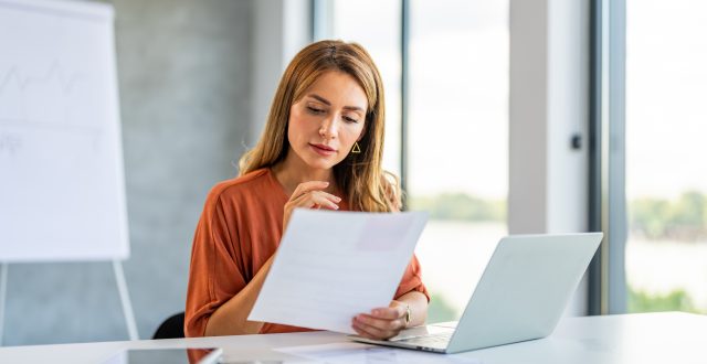 Business woman busy working on laptop computer at office