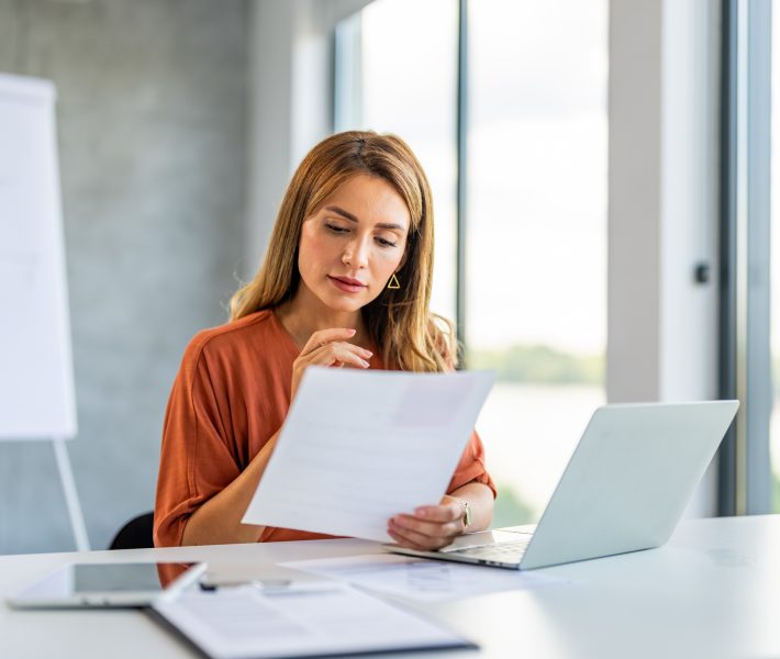 Business woman busy working on laptop computer at office