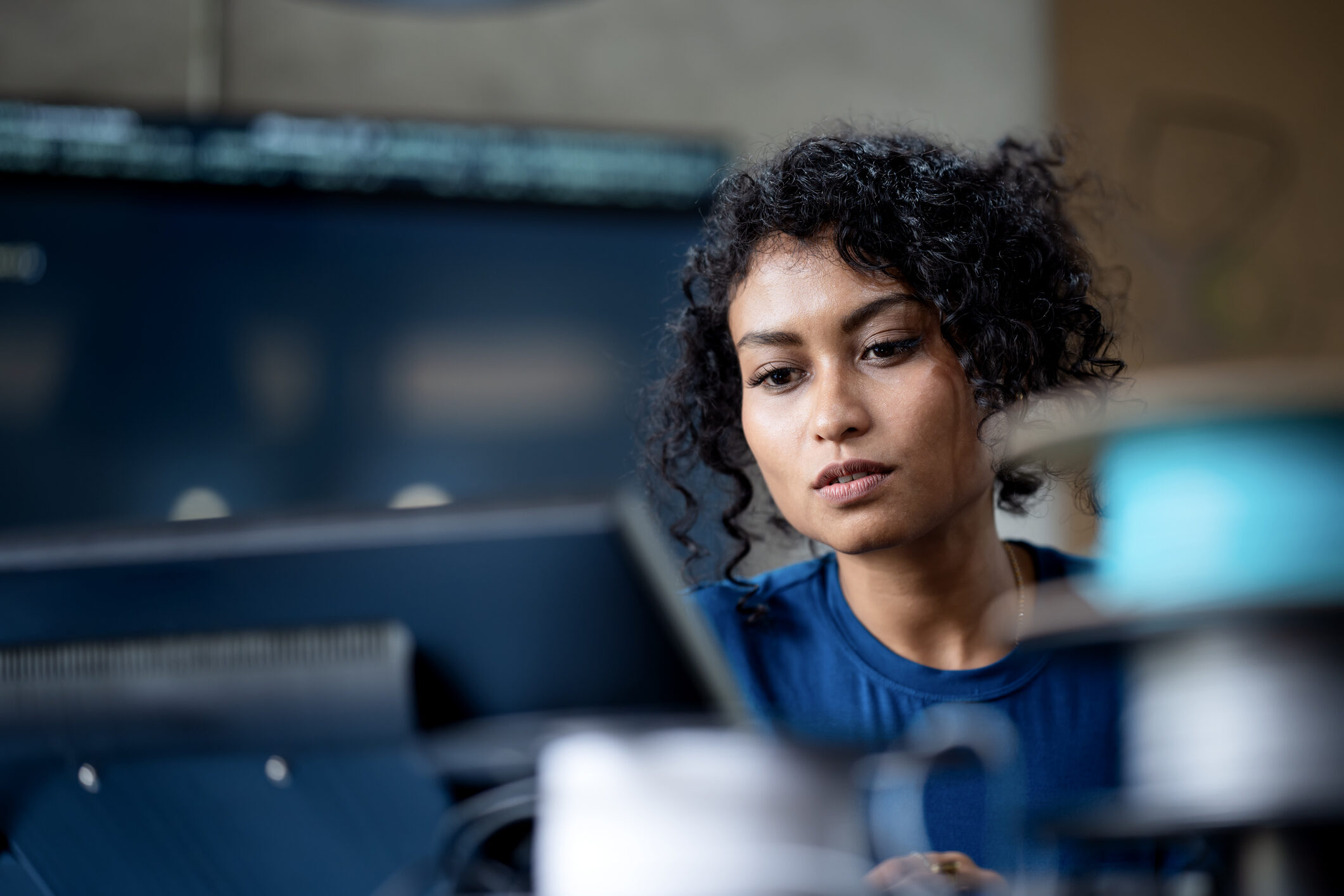 female software engineer on software project development to analyzing and ensuring reliability in a tech business office