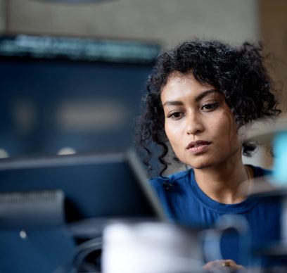 female software engineer on software project development to analyzing and ensuring reliability in a tech business office