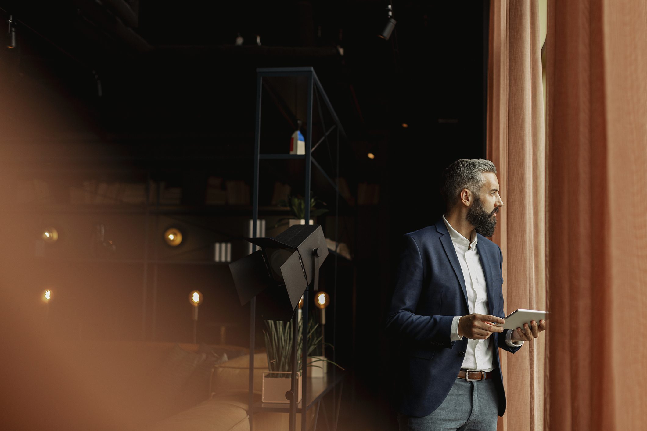 Businessman in cafe holding digital tablet