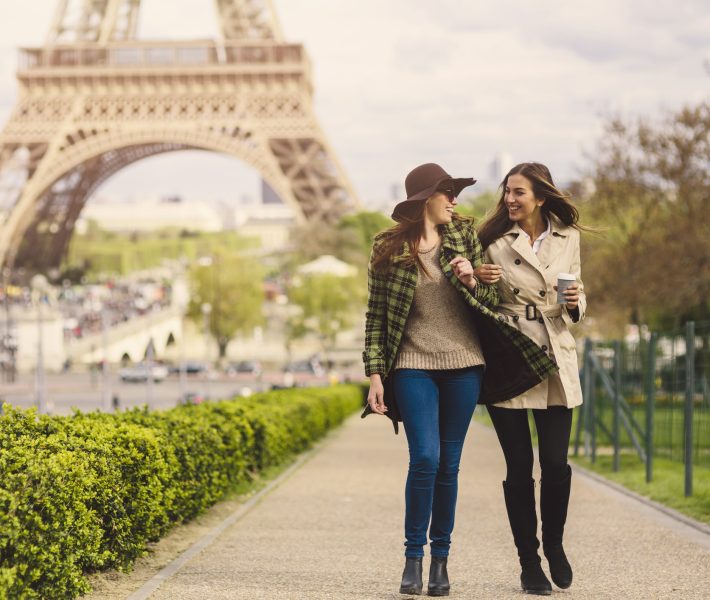 Two friends taking a walk around the Eiffel Tower in Paris